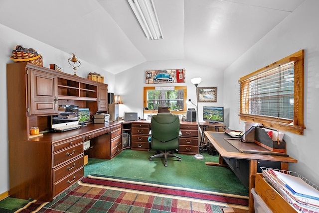 carpeted office with vaulted ceiling