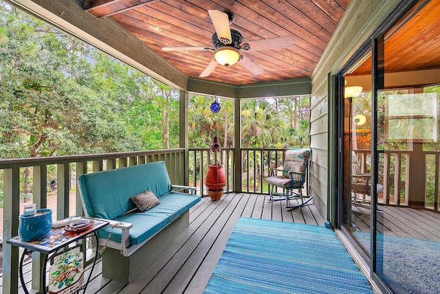 deck featuring ceiling fan and an outdoor living space