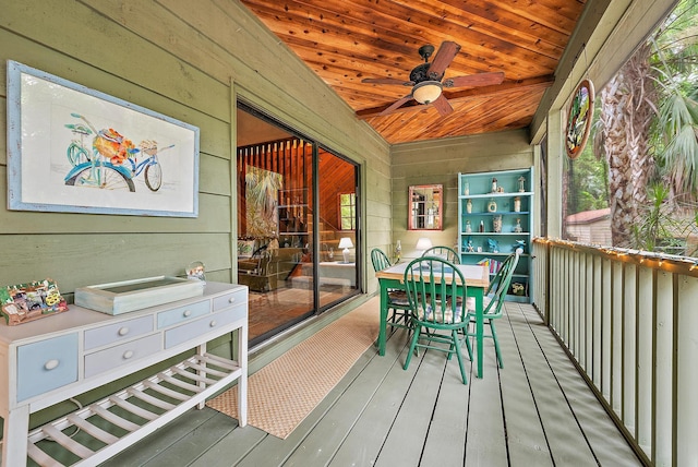 wooden deck featuring ceiling fan