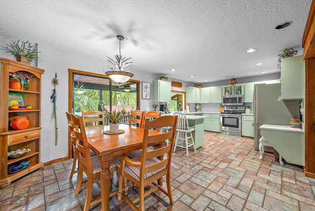 dining area with a textured ceiling