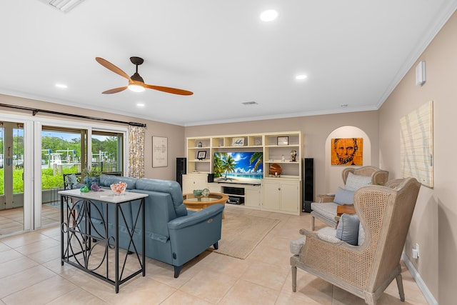 tiled living room featuring ceiling fan and crown molding