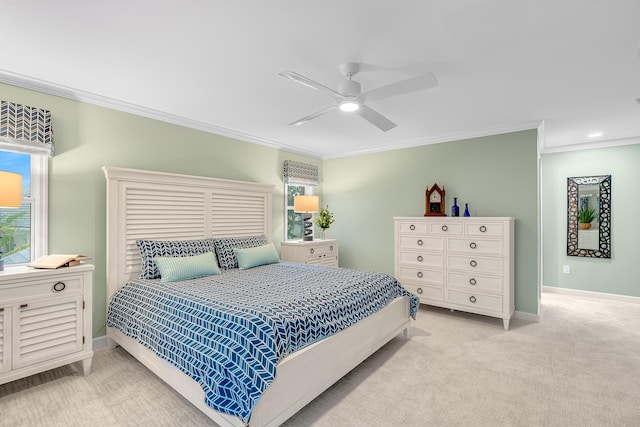 carpeted bedroom with crown molding, multiple windows, and ceiling fan