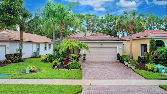 view of front of property featuring a front lawn and a garage