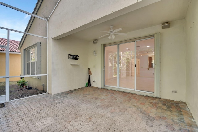 exterior space with ceiling fan and a lanai