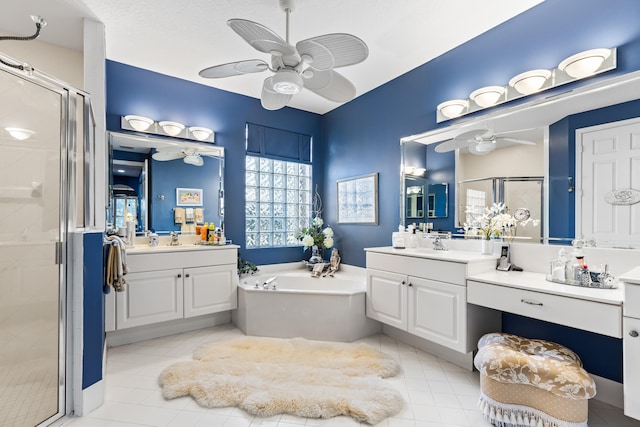 bathroom with vanity, ceiling fan, and plus walk in shower