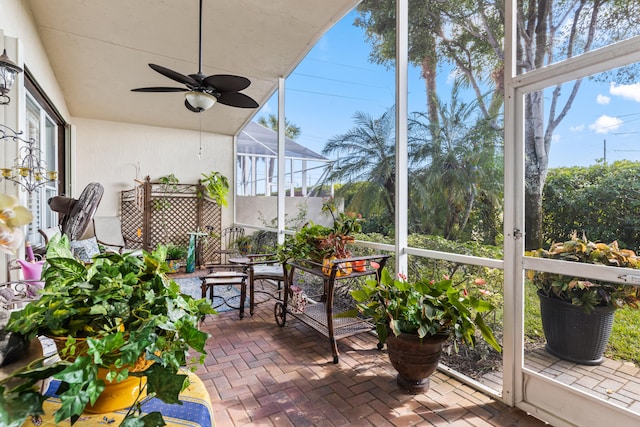 sunroom / solarium with ceiling fan and plenty of natural light