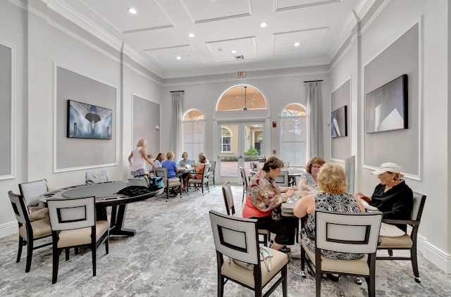 dining room with french doors, crown molding, and coffered ceiling