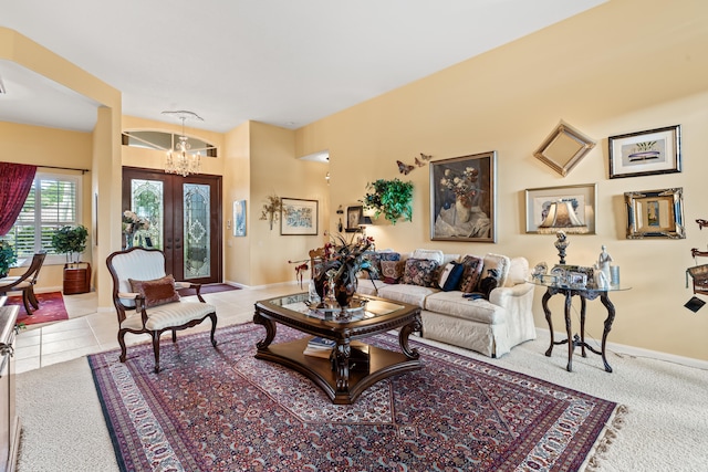 carpeted living room with french doors and an inviting chandelier