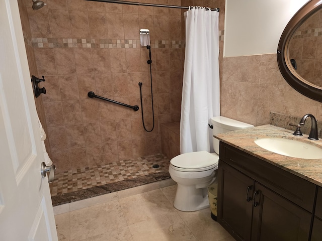 bathroom with a shower with shower curtain, vanity, toilet, and tile walls