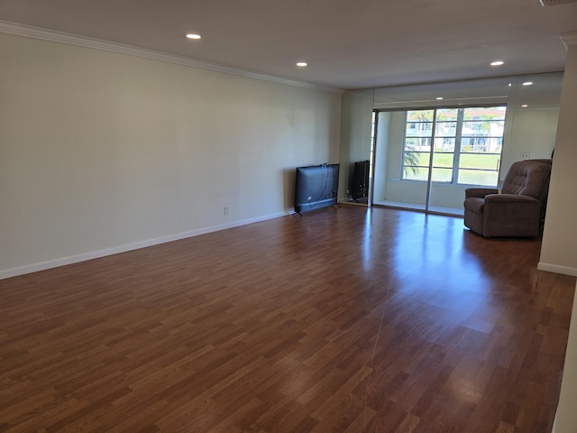 unfurnished living room with dark hardwood / wood-style floors and ornamental molding