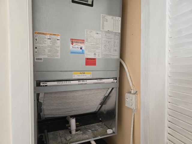 utility room featuring heating unit