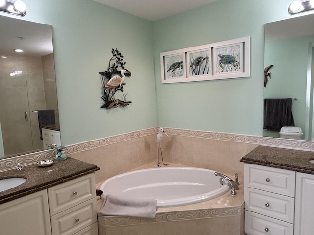 bathroom featuring vanity and plus walk in shower