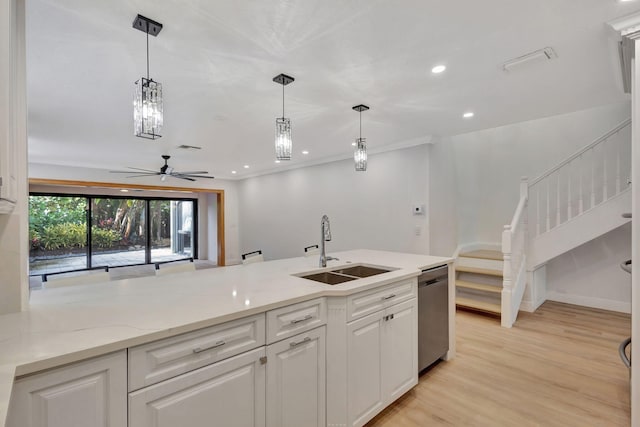 kitchen with ceiling fan, sink, dishwasher, white cabinets, and light hardwood / wood-style floors