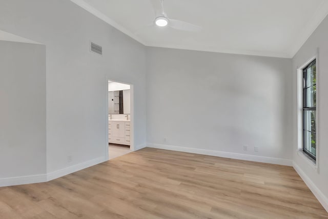 unfurnished room featuring ceiling fan, light hardwood / wood-style floors, and ornamental molding