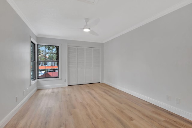 interior space featuring ceiling fan, ornamental molding, and light hardwood / wood-style flooring