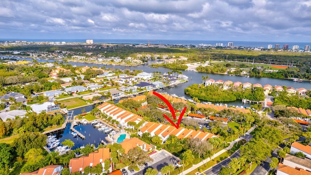 birds eye view of property featuring a water view