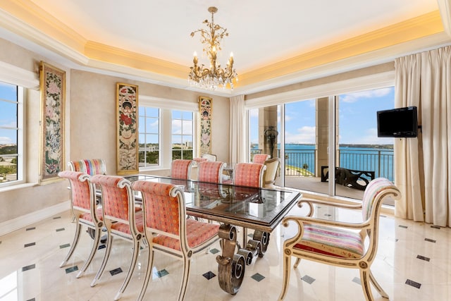 dining room with light tile patterned floors, a raised ceiling, a notable chandelier, and crown molding