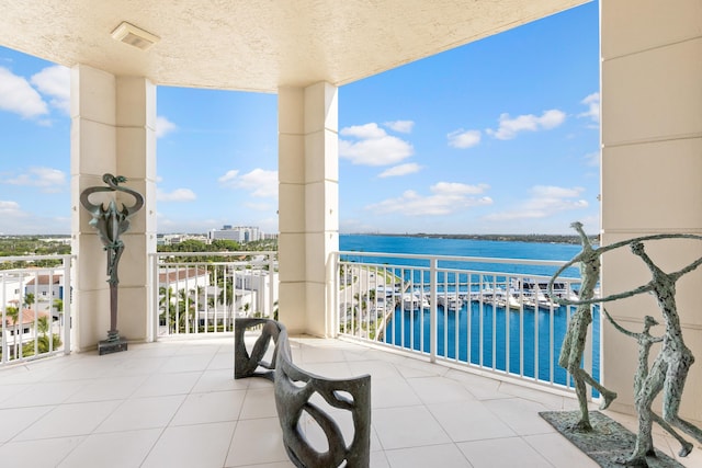 balcony featuring a water view