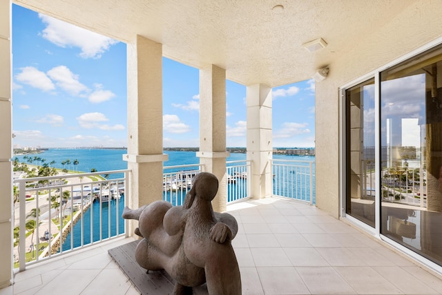 balcony featuring a water view