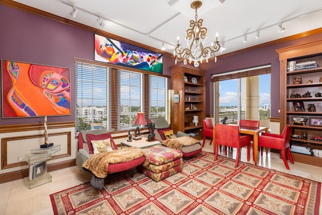 living area with a wealth of natural light, tile patterned flooring, and a chandelier