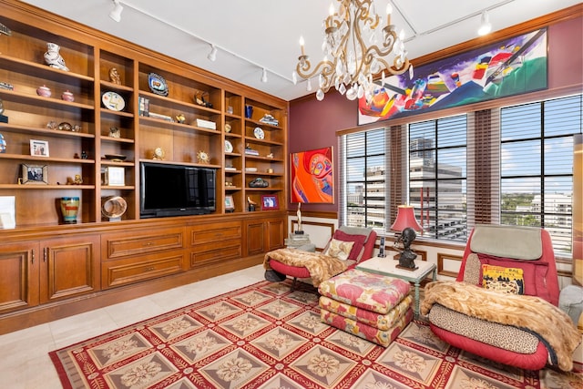 sitting room featuring light tile patterned floors, a notable chandelier, and rail lighting