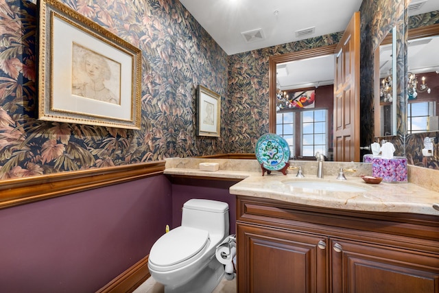 bathroom with vanity and toilet