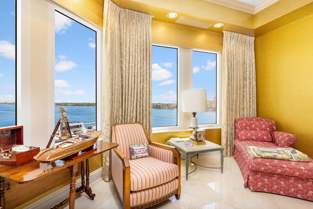 living area featuring a water view, light tile patterned floors, and ornamental molding