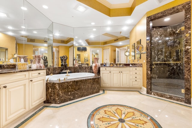 bathroom with vanity, crown molding, and independent shower and bath