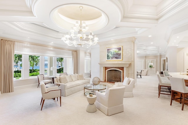 carpeted living room with a premium fireplace, ornamental molding, coffered ceiling, and an inviting chandelier