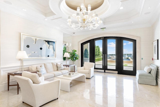 living room featuring coffered ceiling, a chandelier, crown molding, and french doors