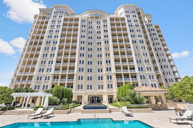 view of pool featuring a patio area and a pergola