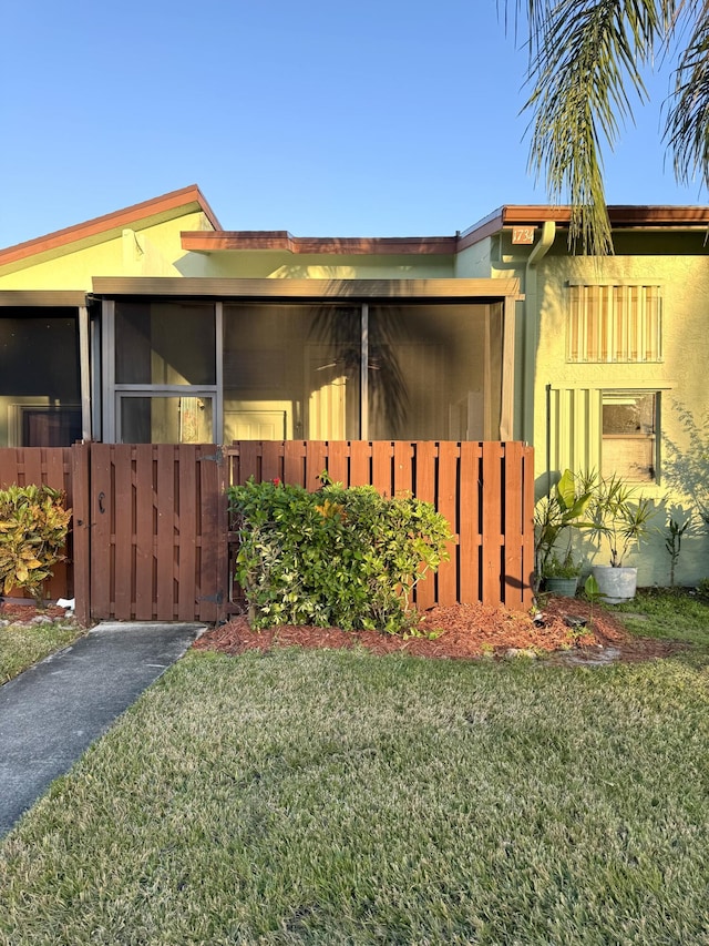 view of home's exterior with a yard