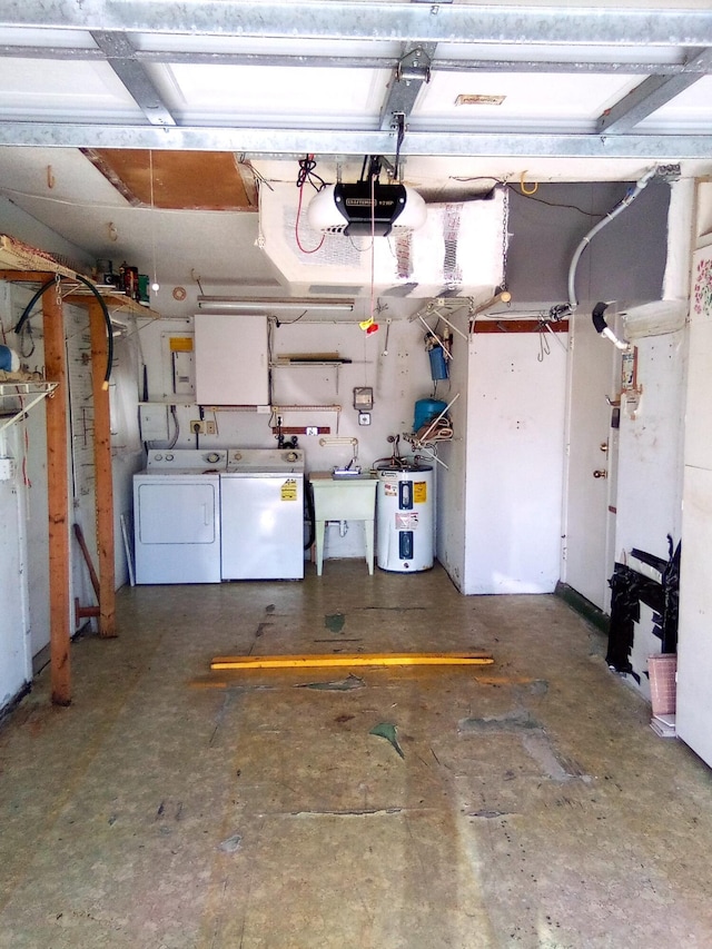 garage with washer and clothes dryer, sink, a garage door opener, and water heater