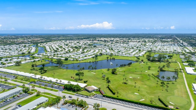 aerial view with view of golf course and a water view