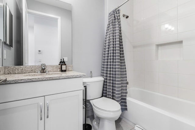 full bathroom with shower / tub combo, vanity, and toilet