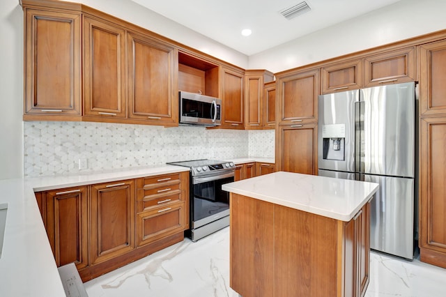 kitchen with a center island, stainless steel appliances, light stone counters, and tasteful backsplash