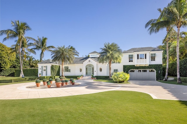 view of front facade featuring a garage and a front lawn