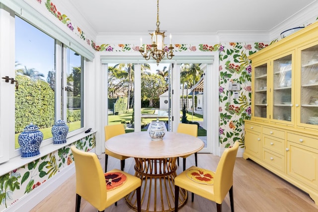 sunroom featuring an inviting chandelier