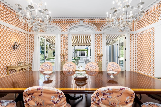 dining area featuring a chandelier and ornamental molding