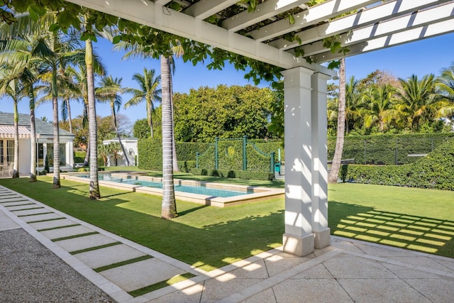 view of patio / terrace featuring a fenced in pool and a pergola