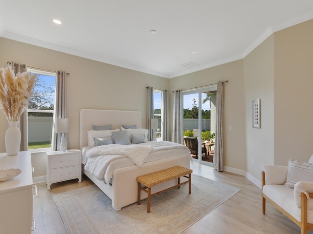 bedroom with light hardwood / wood-style floors and ornamental molding