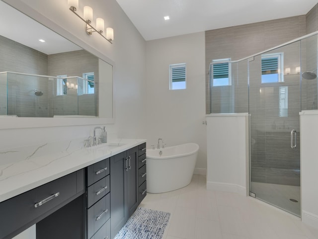 bathroom featuring separate shower and tub, tile patterned floors, and vanity