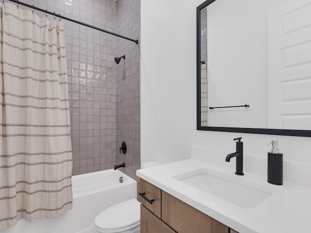 full bathroom with shower / bath combination with curtain, vanity, and toilet