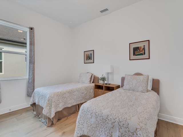 bedroom featuring hardwood / wood-style flooring