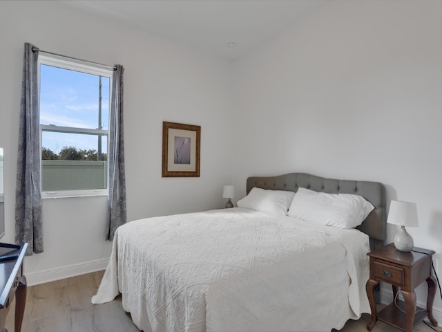 bedroom with light hardwood / wood-style floors