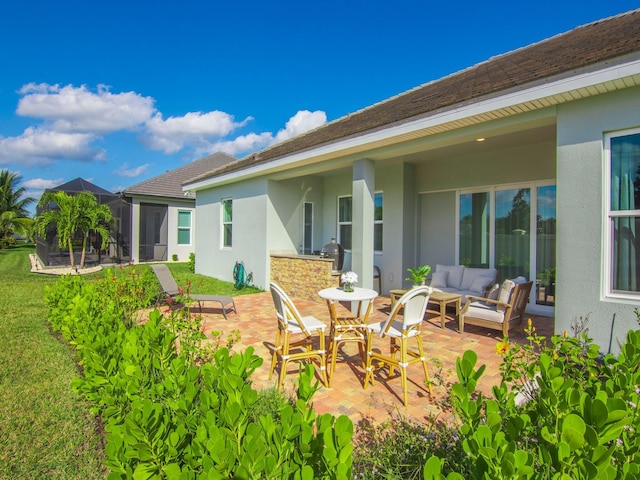 rear view of property with a patio and an outdoor hangout area