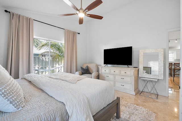 bedroom featuring ceiling fan and access to outside