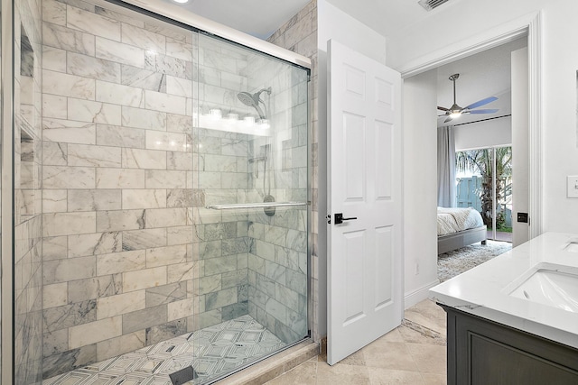 bathroom with ceiling fan, an enclosed shower, and vanity