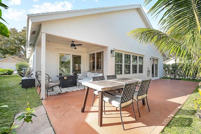 view of patio with central AC, ceiling fan, and an outdoor living space