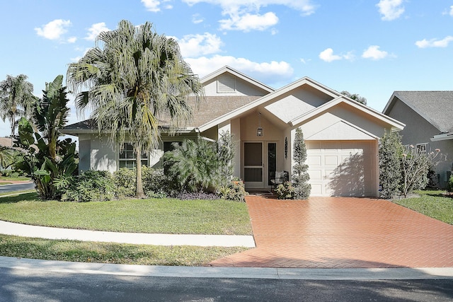 view of front of home featuring a front yard and a garage